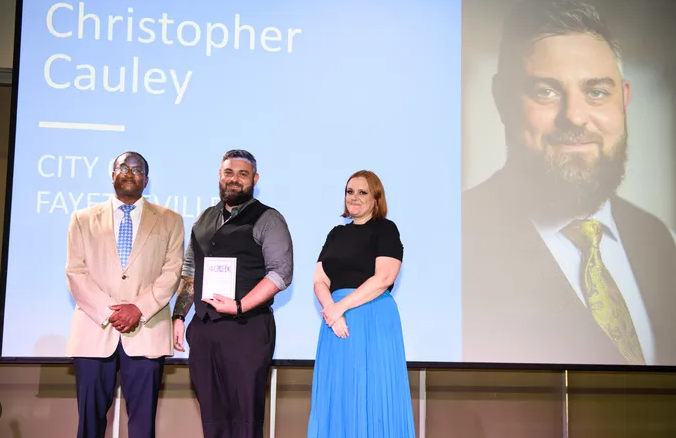 Christopher Cauley recognized on stage