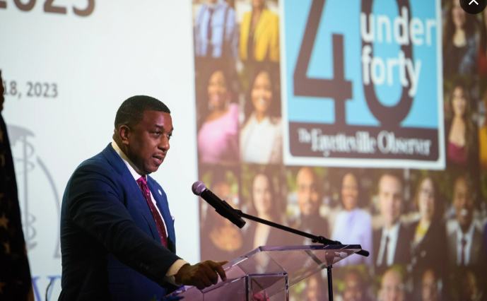 Honoree speaking at the podium